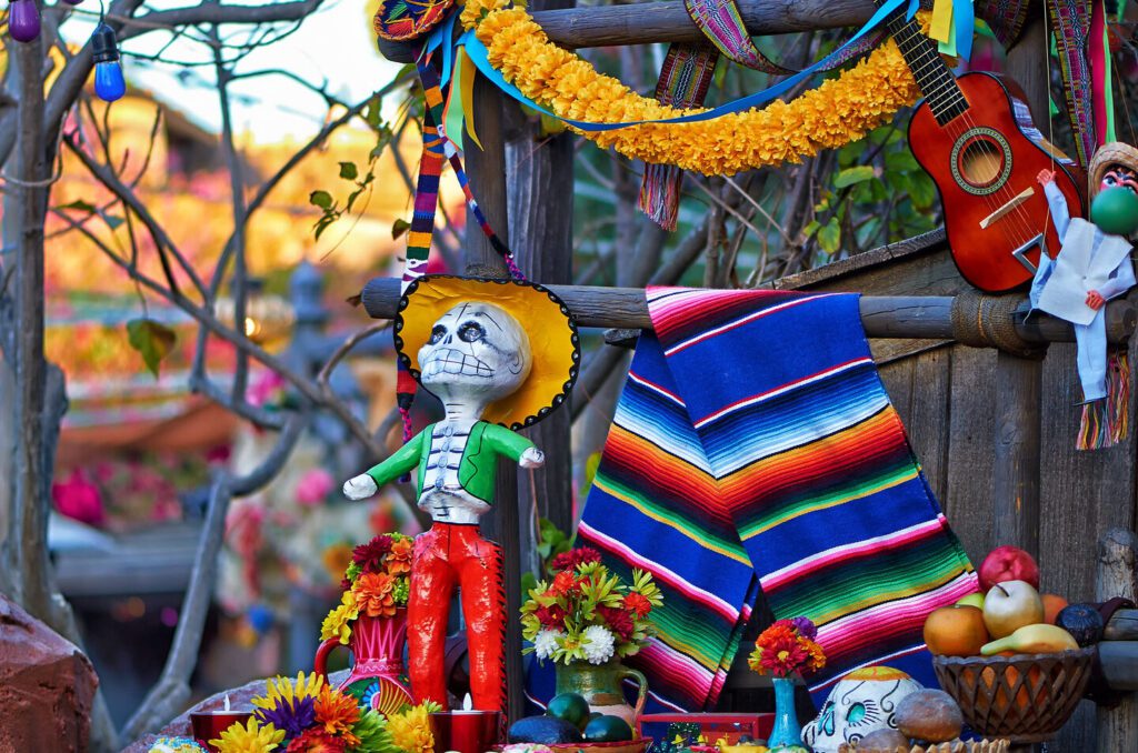 una imagen colorida y vibrante de una ofrenda tradicional del dia de los muertos con elementos relacionados con el coco