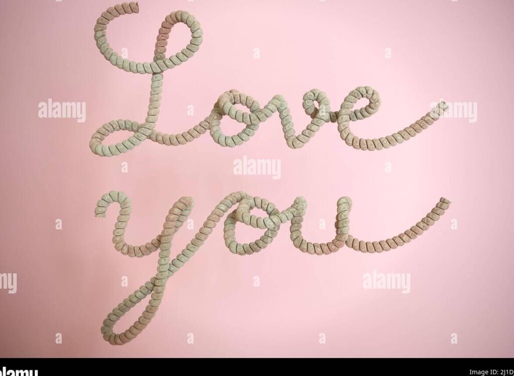 una imagen con fondo rosa y letras doradas que dicen frases de dios para el amor en san valentin