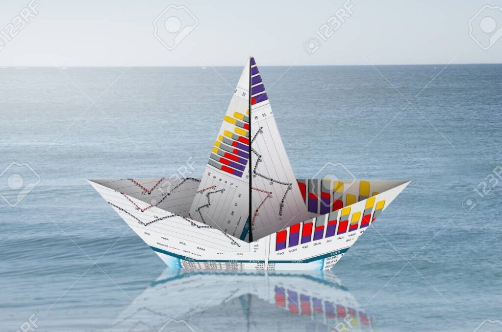 una imagen de un barquito de papel flotando en el agua
