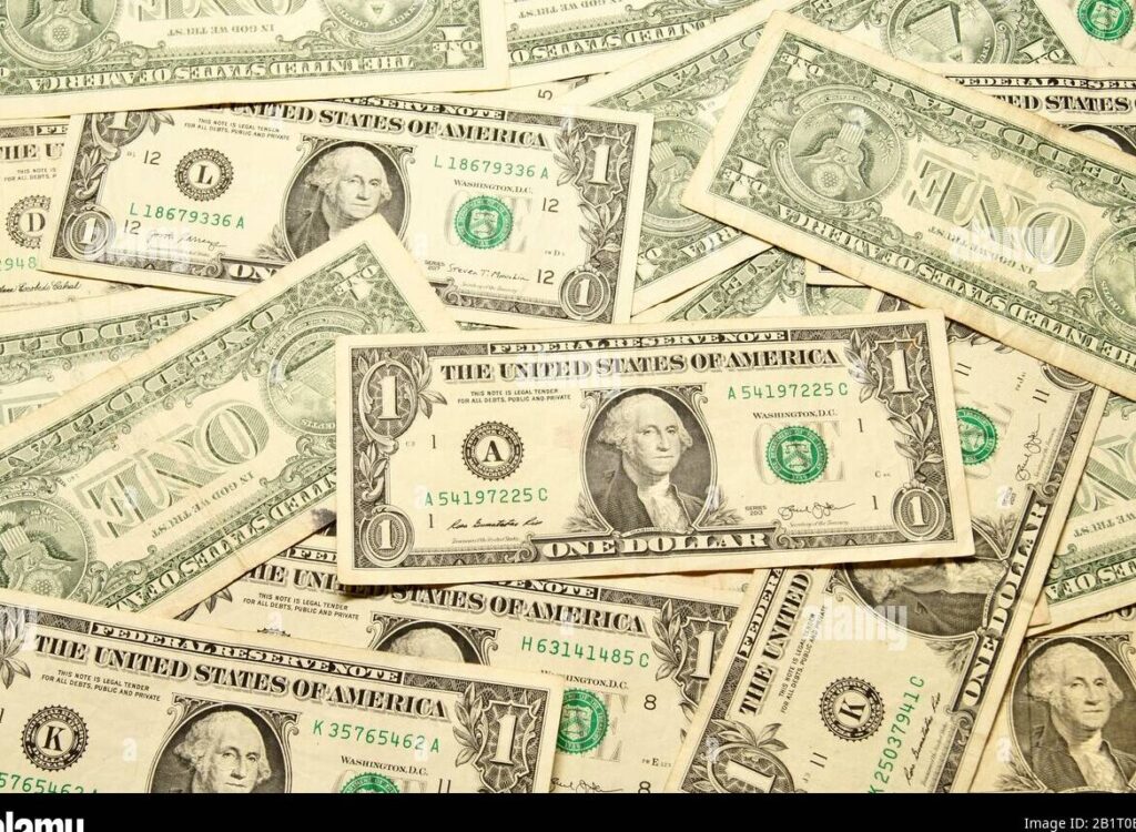una imagen de un billete de dinero con el logotipo de pink floyd superpuesto