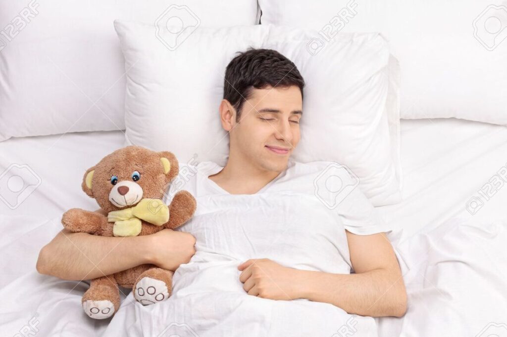 una imagen de una persona durmiendo tranquilamente en una cama comoda