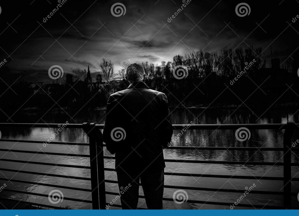 una imagen en blanco y negro de una persona triste solitaria en un paisaje melancolico